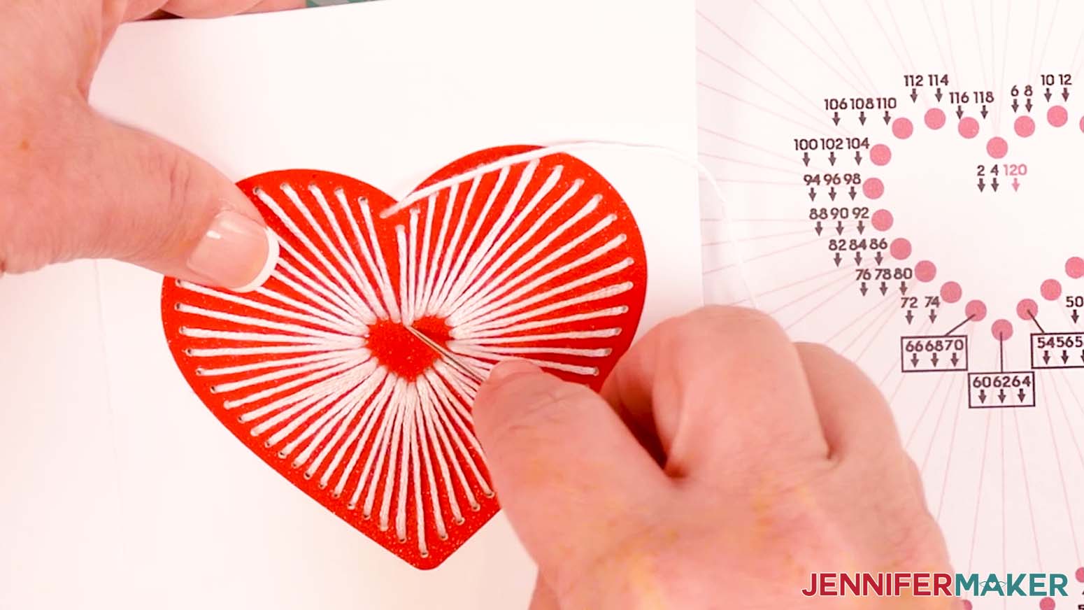 Continue all the way around the heart and insert the embroidery floss down through hole 120 to complete the embroidered heart design.