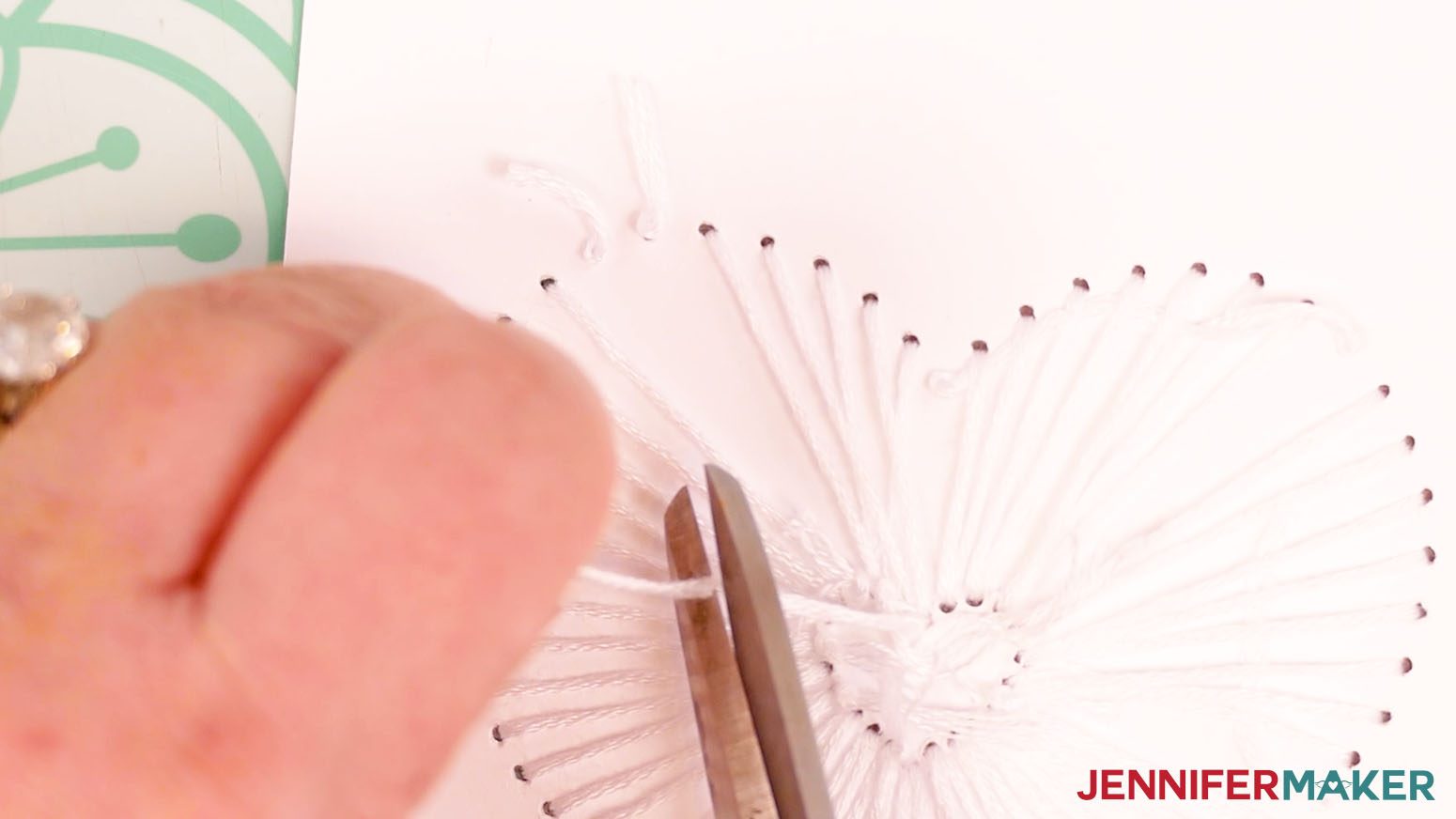 Use scissors to trim away the extra embroidery floss.
