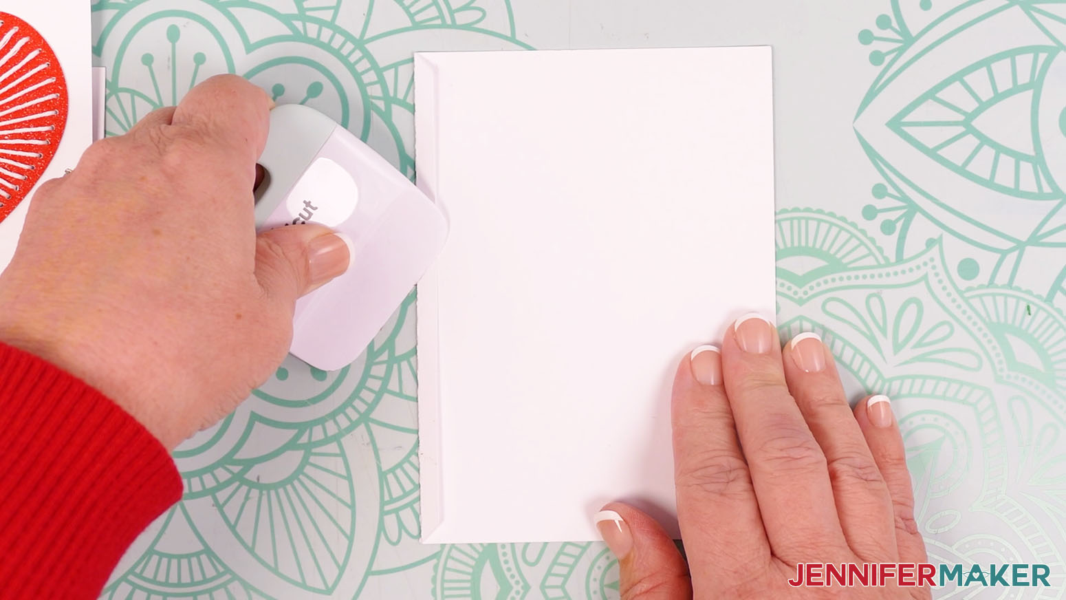 Use a scraper tool to crease along the dashed cut line for the Joy card.
