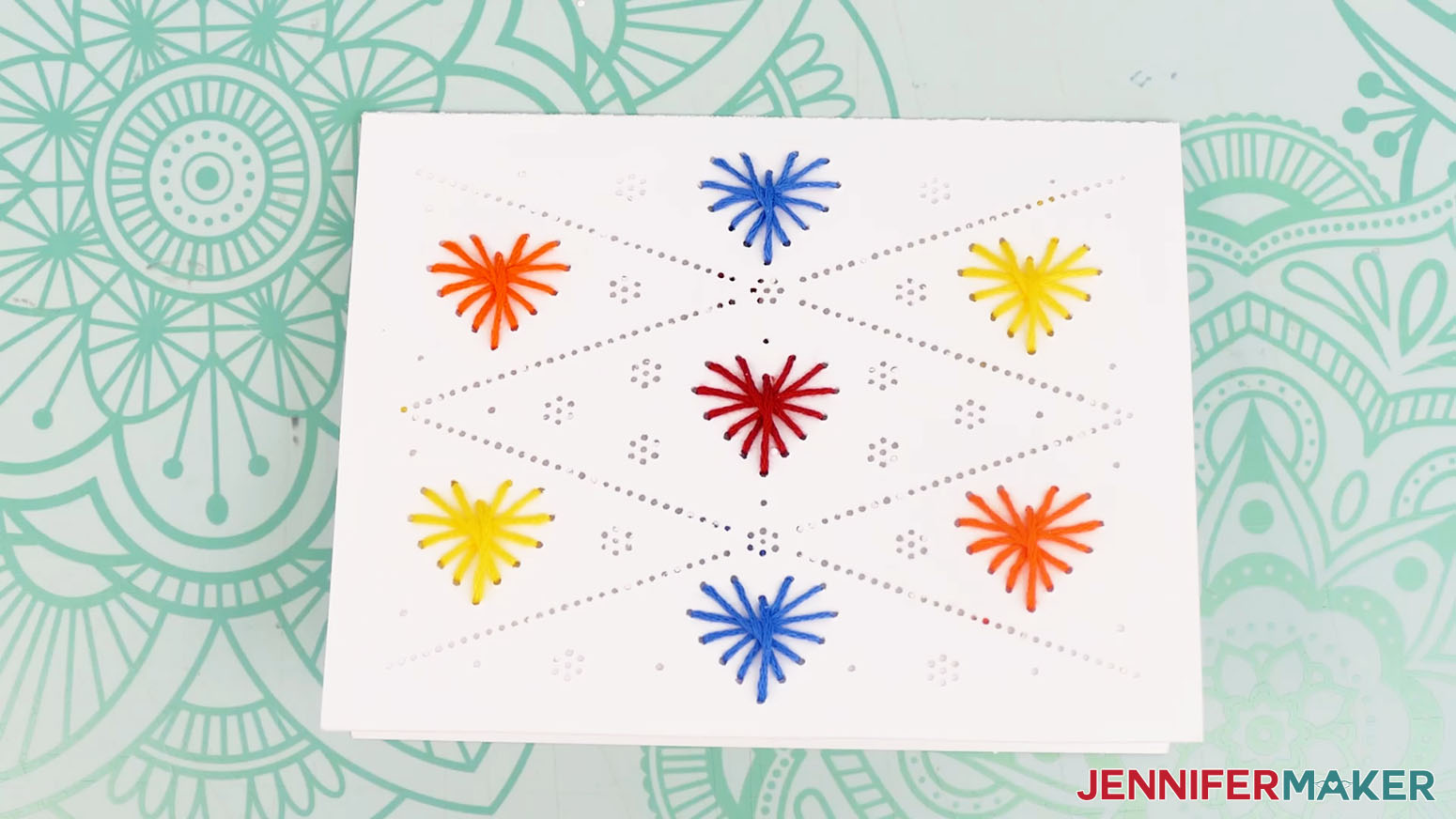 Finished paper emrboidery card with small hearts design.