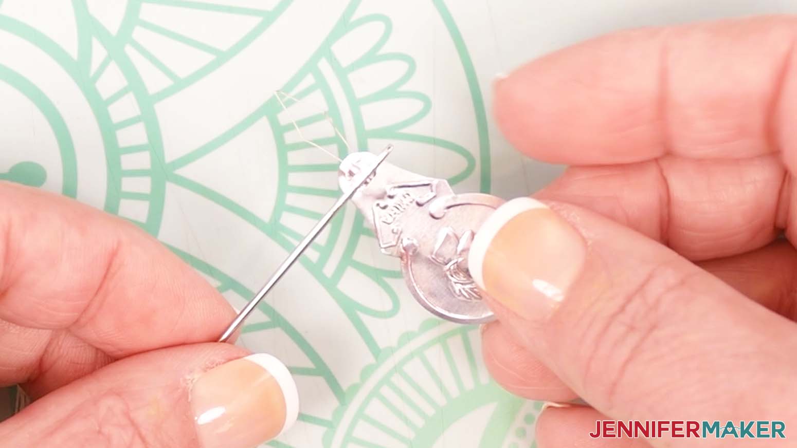 A threader tool can be helpful with getting the embroidery floss through the needle opening.