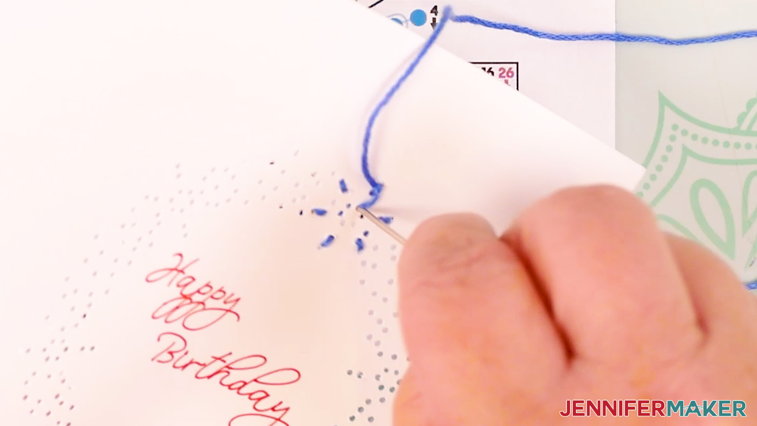 Bring the floss up through hole 13 and loop it under the first part of the embroidery to make a petal shape.