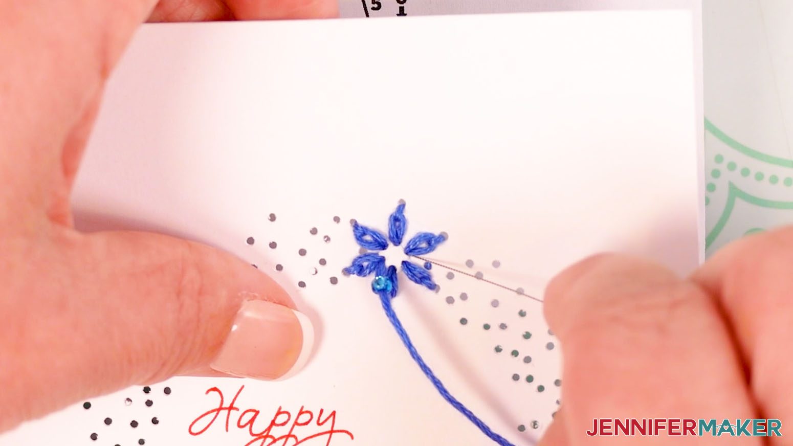 Insert the needle down through hole 26 to make the center bead design of the flower.