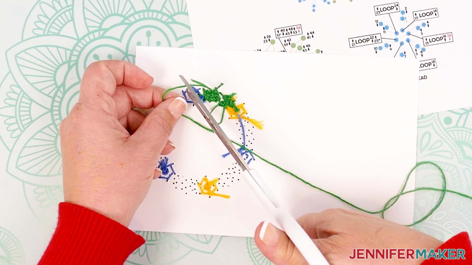 Tie the embroidery floss on the back of the card and trim the excess floss with scissors.
