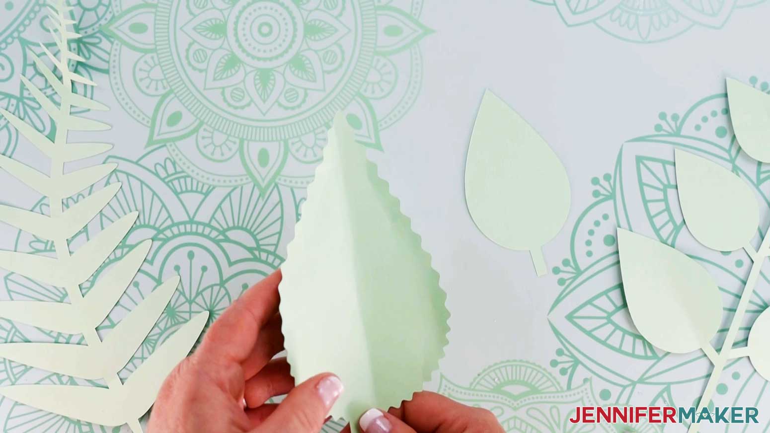 Crease the paper flower backdrop greenery to create depth.