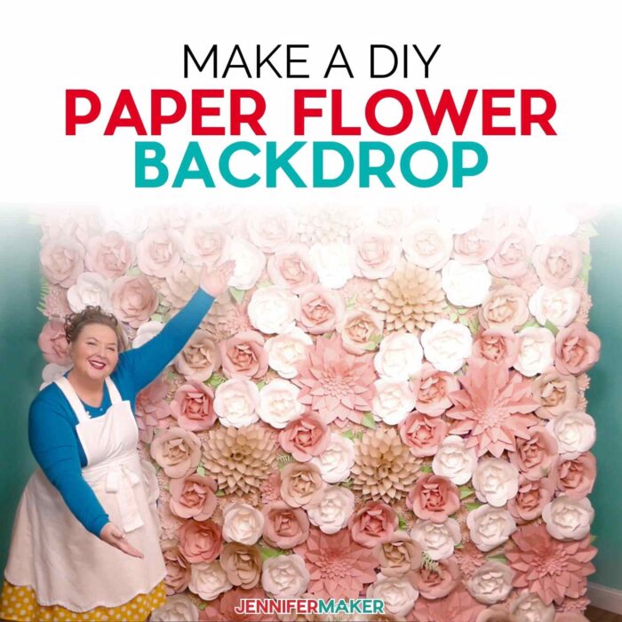 Pink and cream paper flower backdrop displayed with a happy crafter.