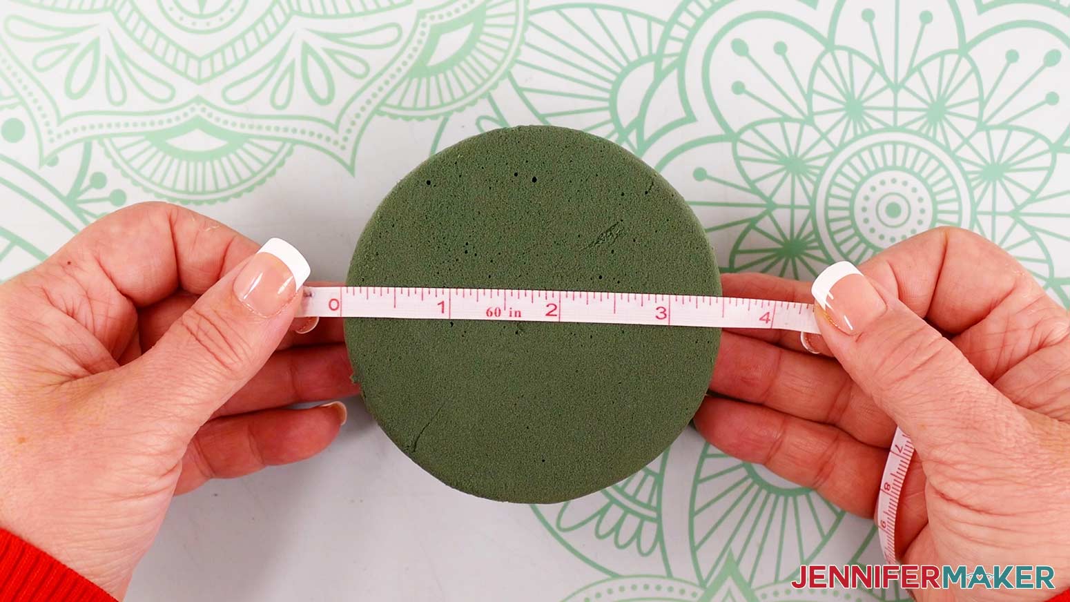 Measure the diameter of the floral foam hemisphere at its base to determine what size your paper flower bouquet vase should be