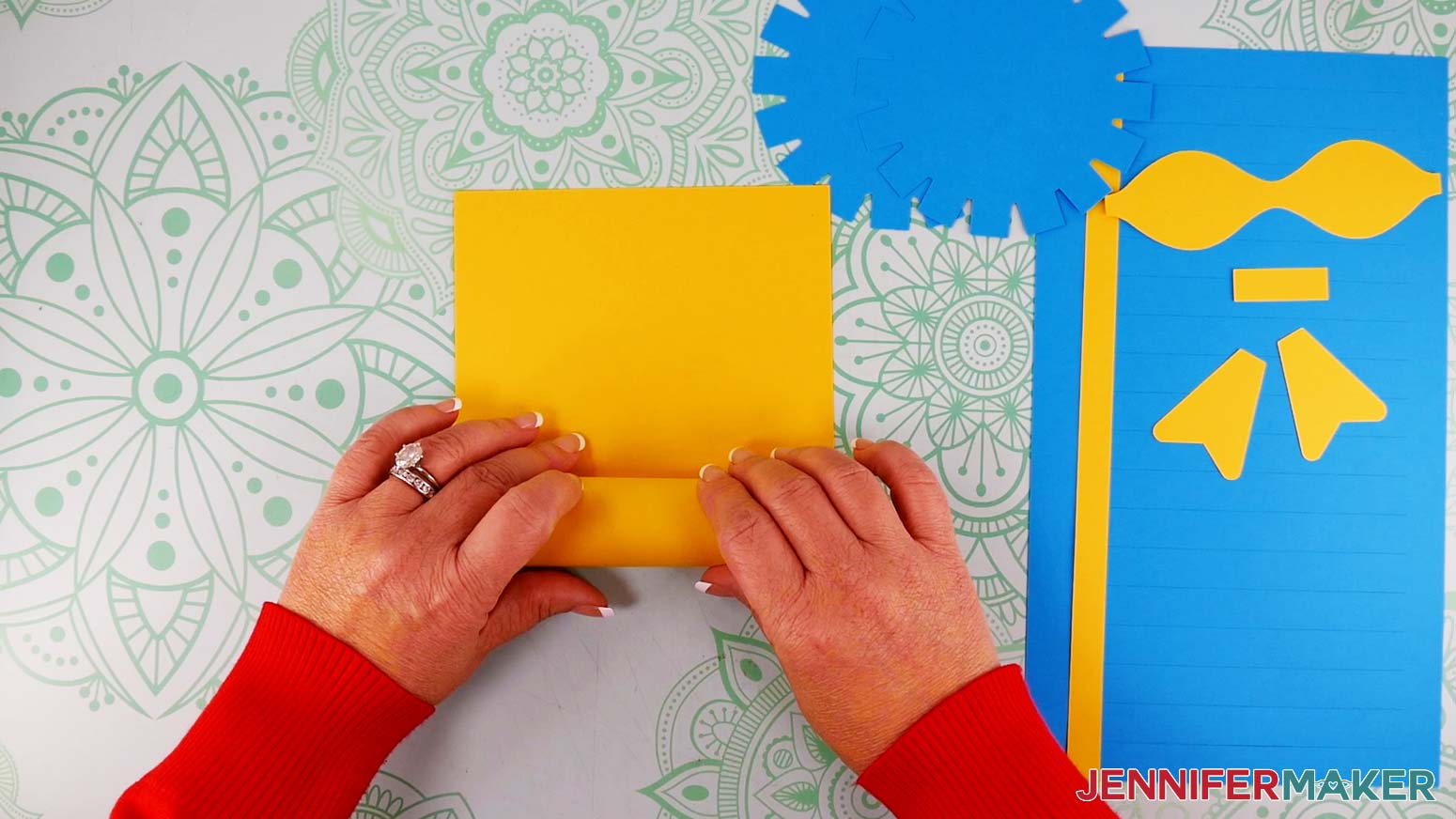 Roll the cardstock for the inner vase piece of the paper flower bouquet before assembling