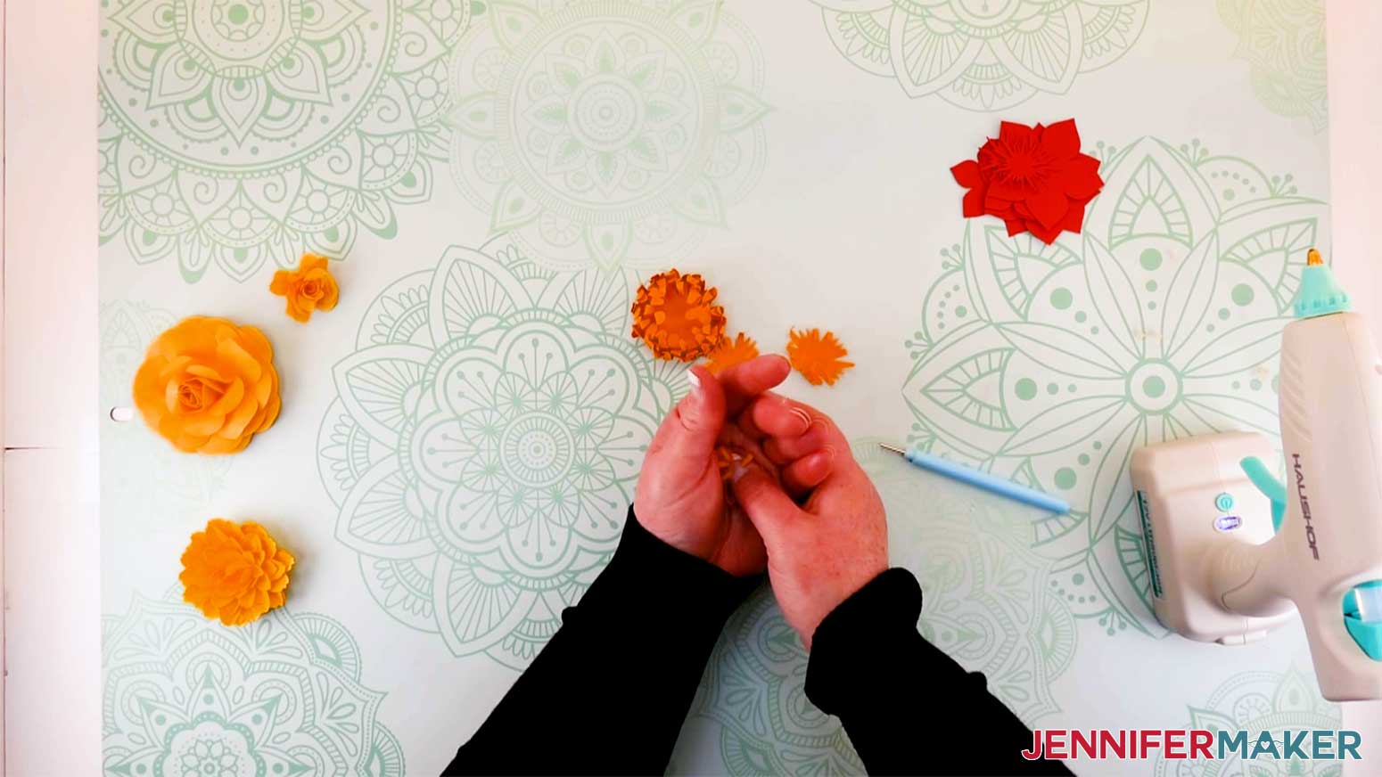 Mold the petals to the paper flower mum in the palm of your hand for my paper flower letter