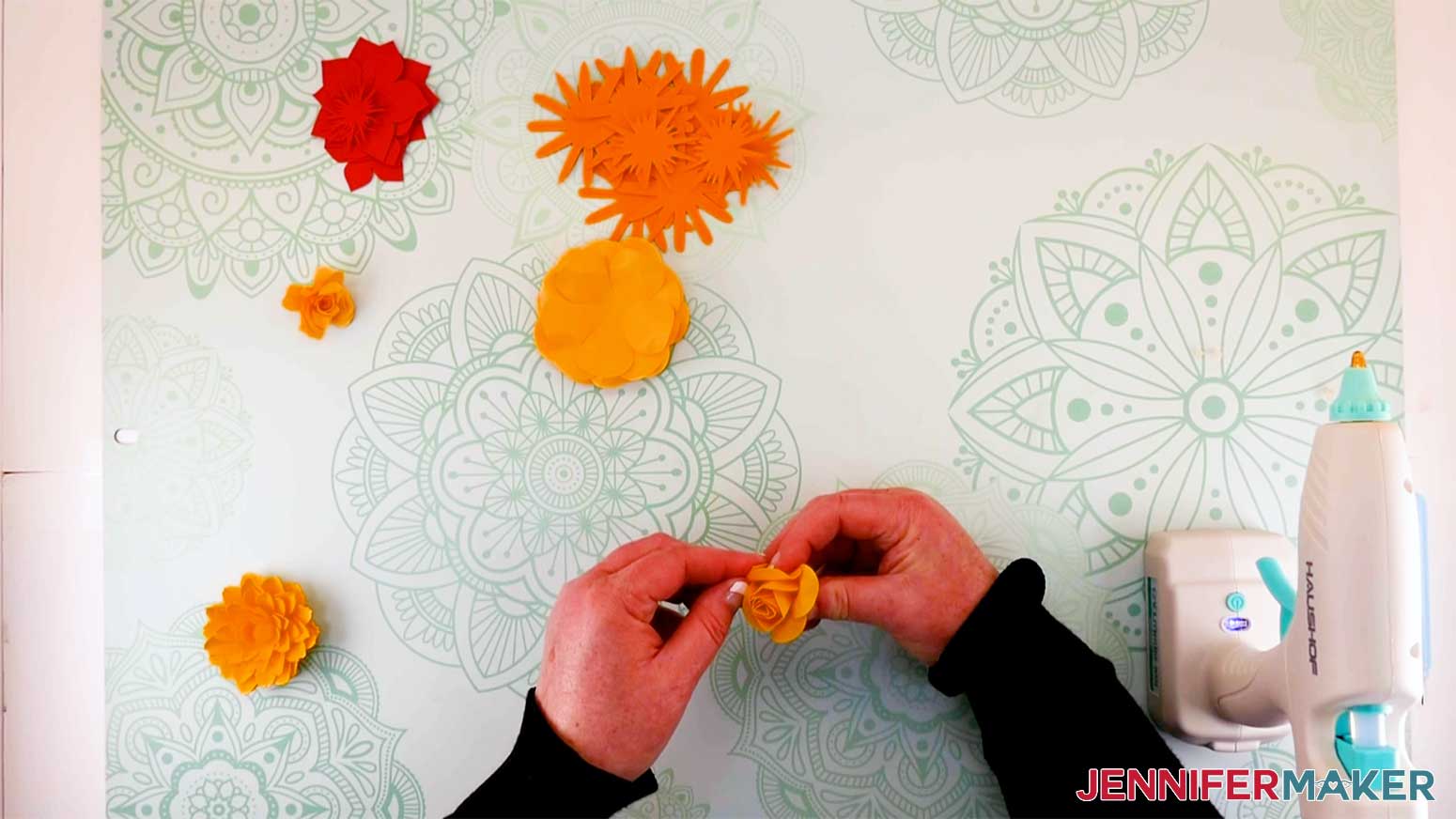 shaping the center of the paper flower before gluing in place for my paper flower letter