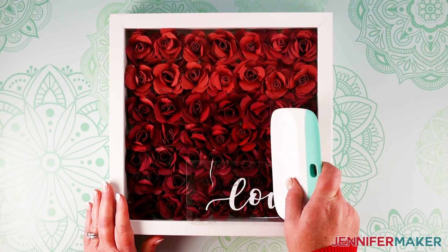 Use a scraper tool to apply the vinyl for my paper flower shadow box