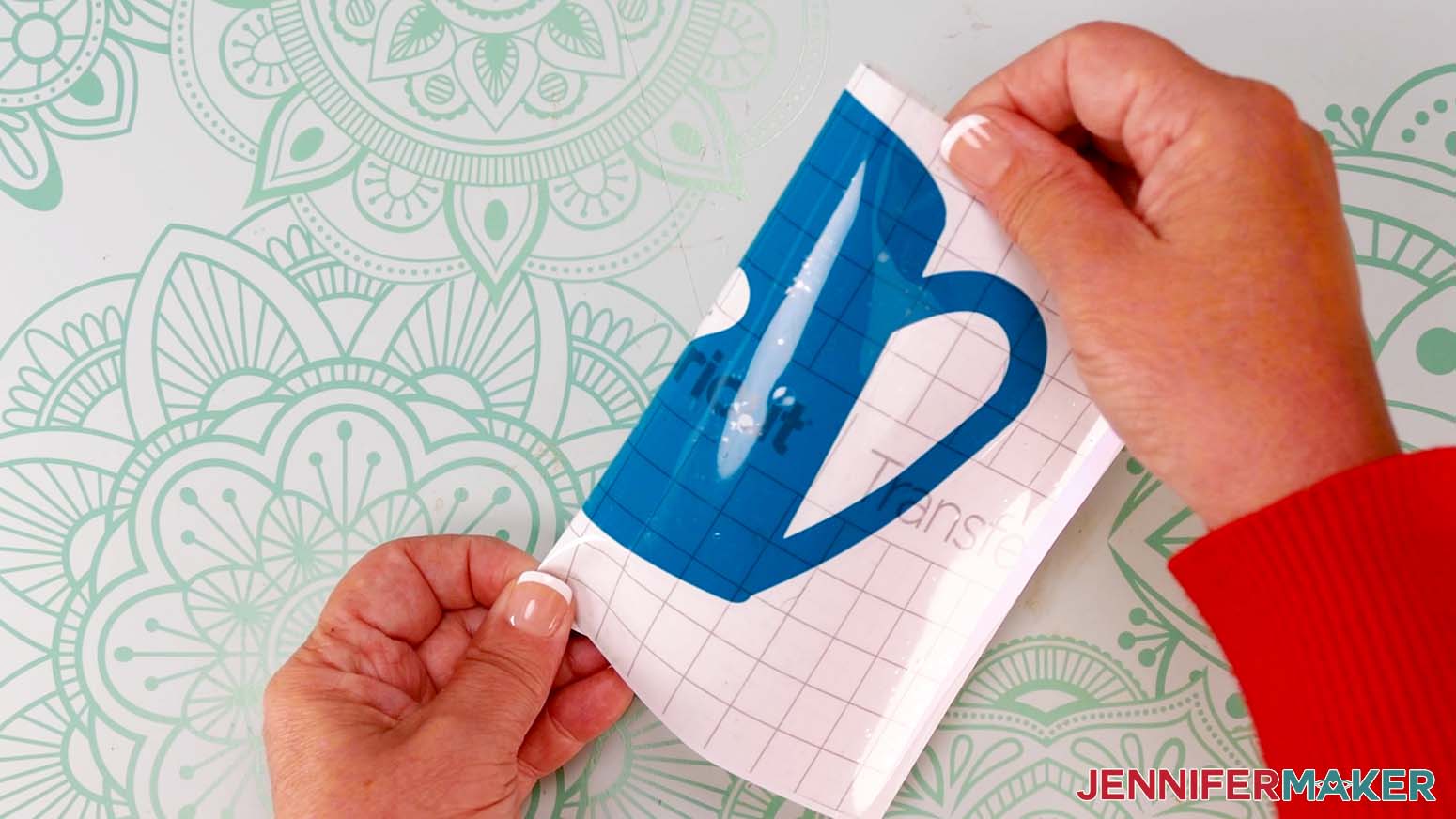 Fold the decal in half to crease the center of the design.