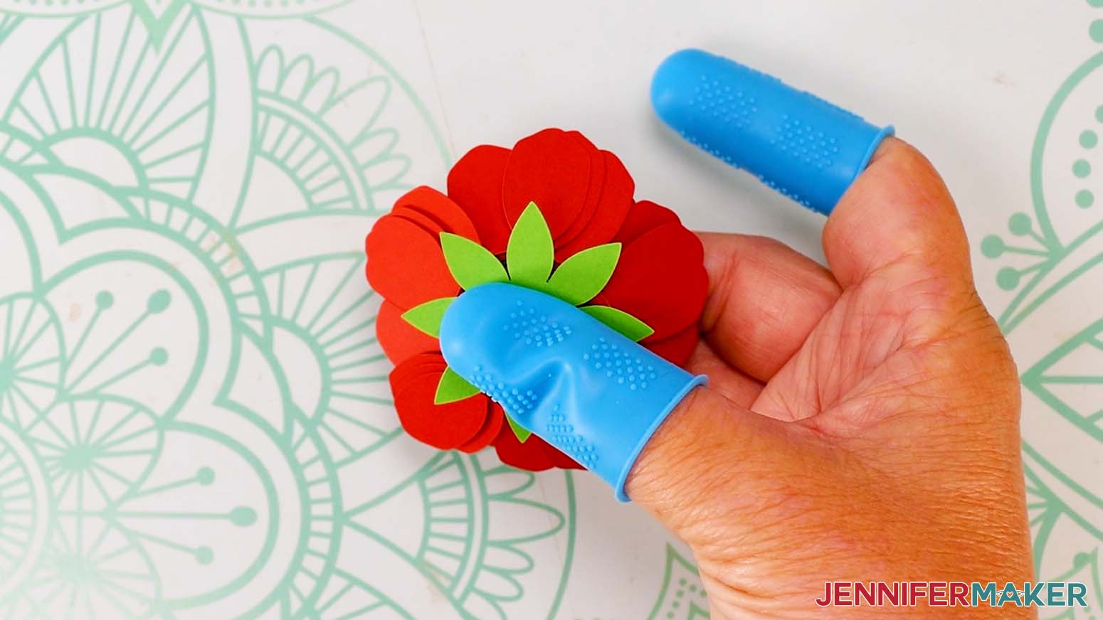 Glue the sepal on the bottom of the flower.