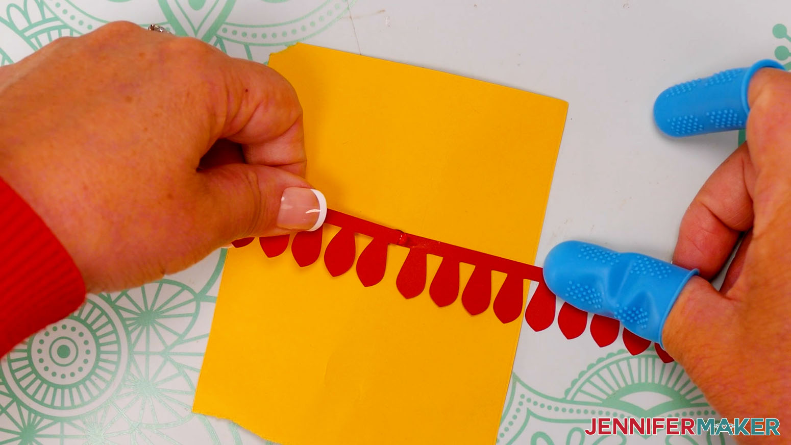 Apply a dab of hot glue to the ends of the gardenia strips to attach them.
