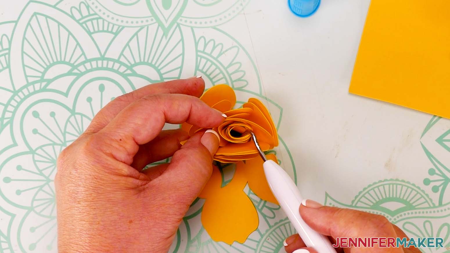 Use a weeding tool to loosen and arrange the center of the flower.