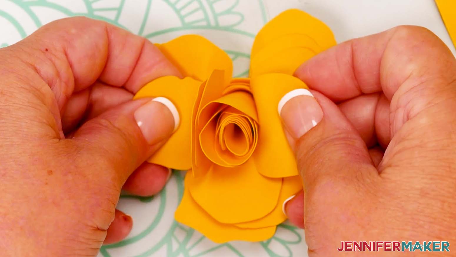 Use fingers to shape the petals of the rose.