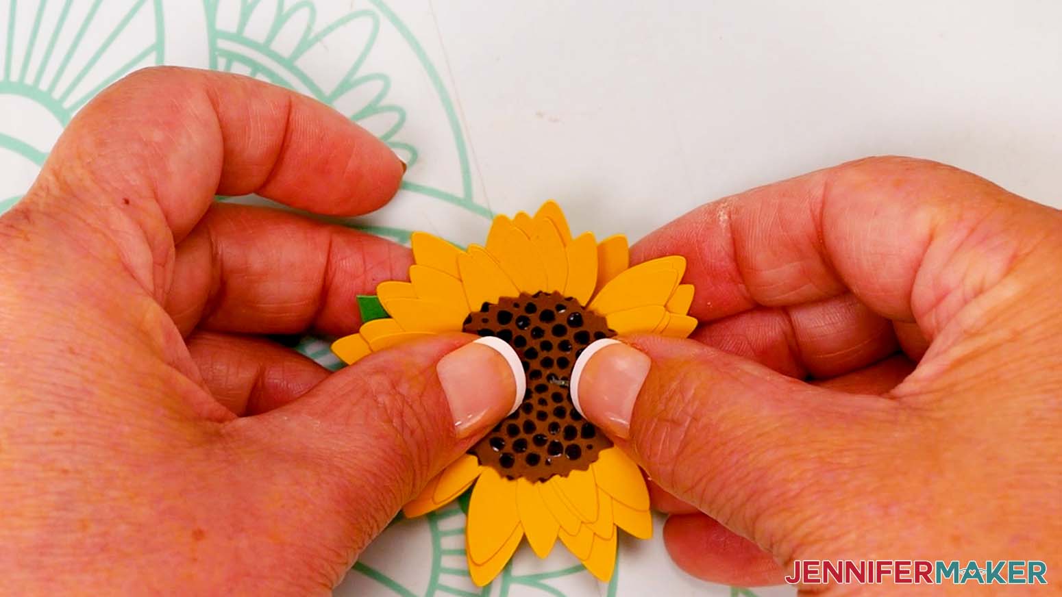 Attach the seed head to the sunflower center.