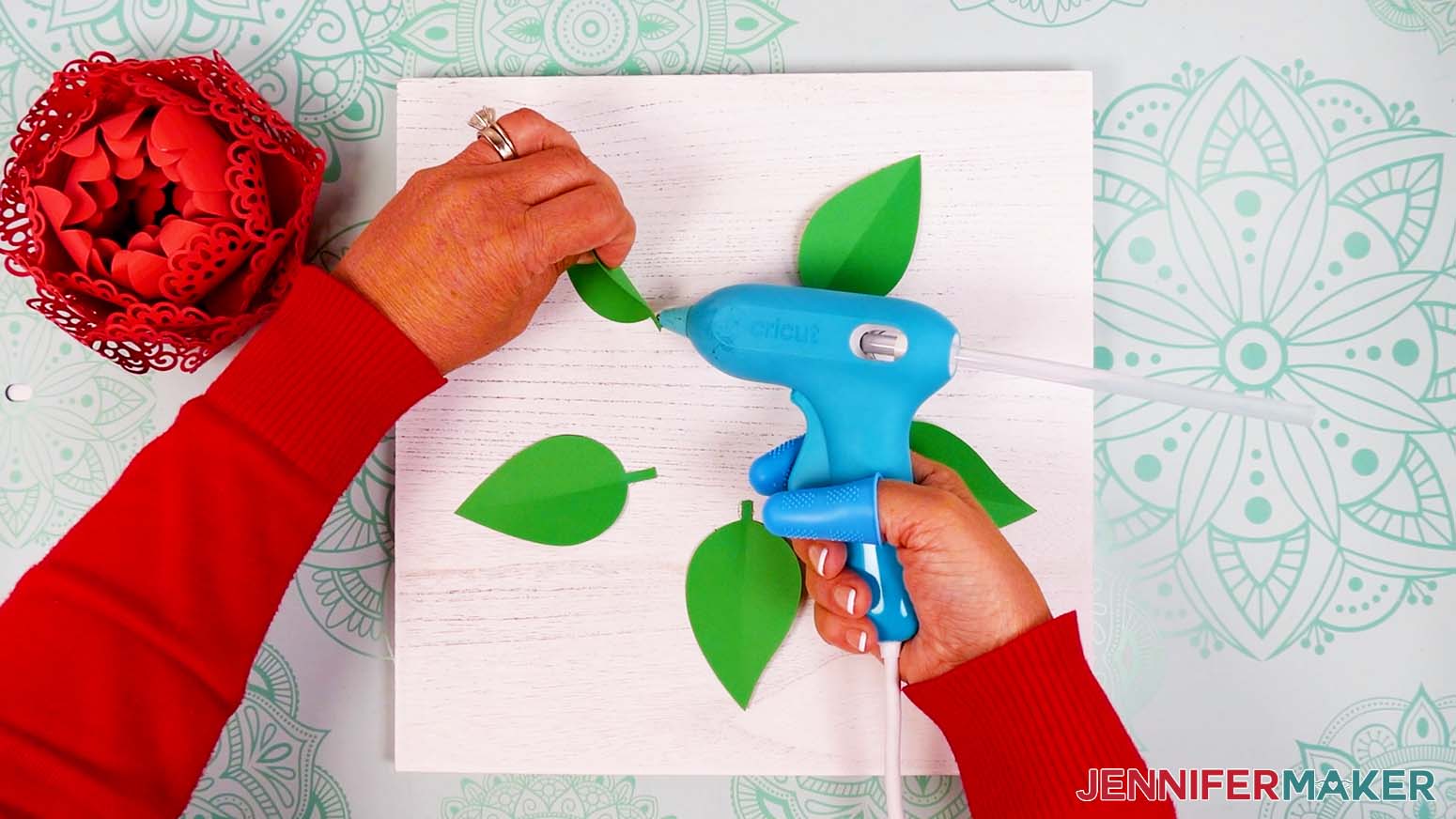 Use hot glue to secure the bottoms of the leaves to the wood.