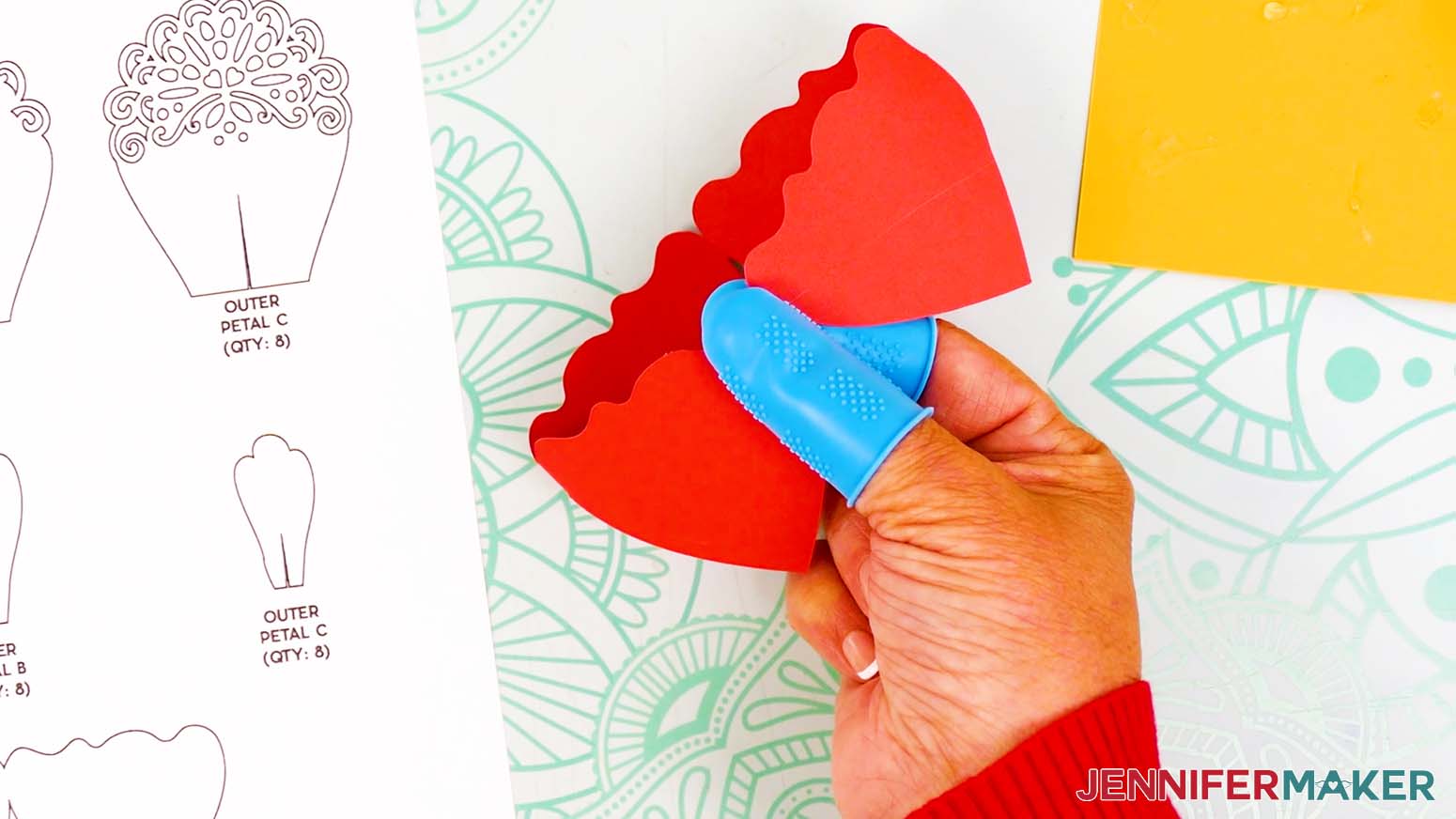 Bring the peony's tab to meet the pointed petal on the opposite end and create a loop.