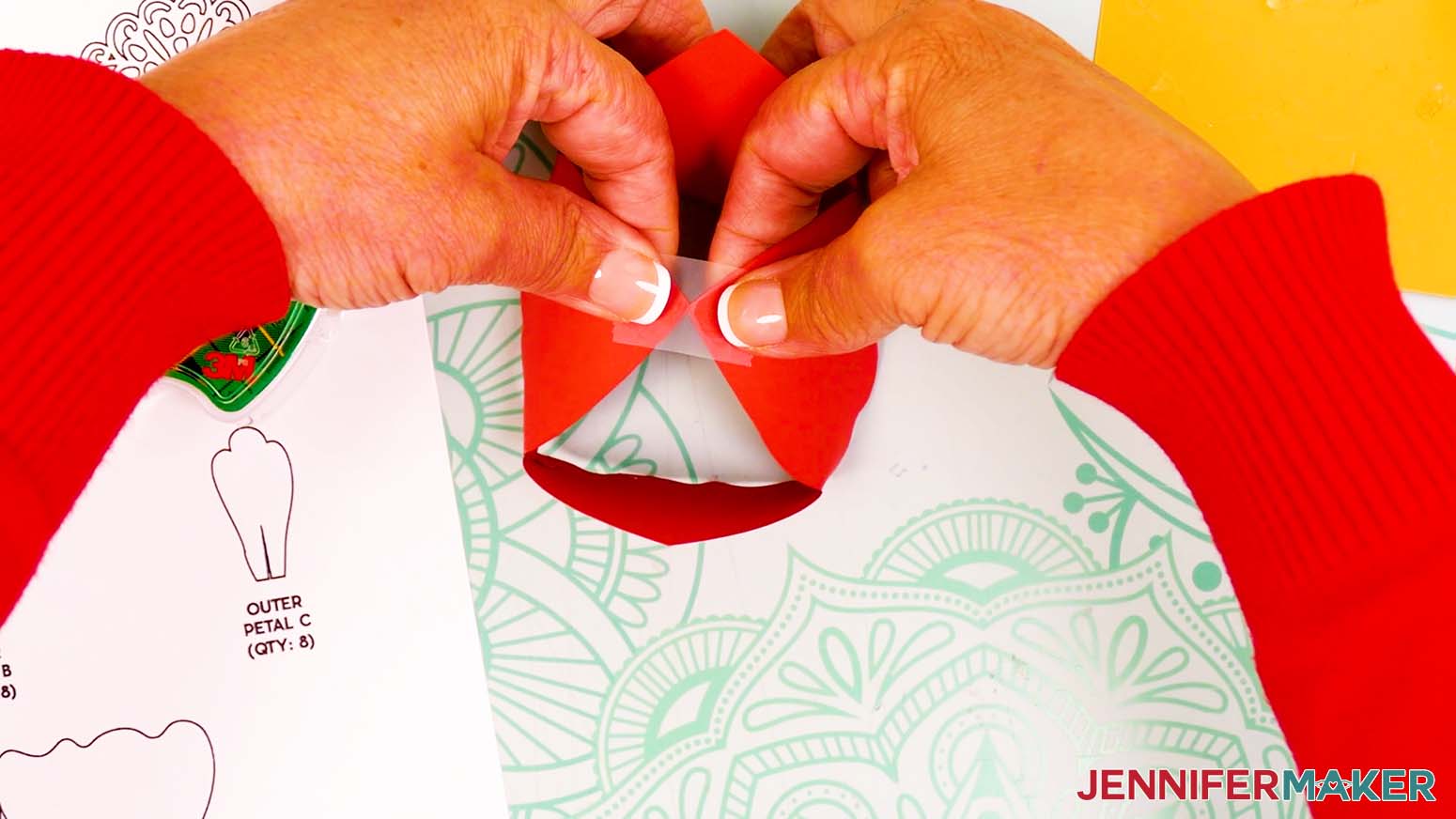 Bring two opposite peony bud tips together so the points align and use clear tape to secure them.