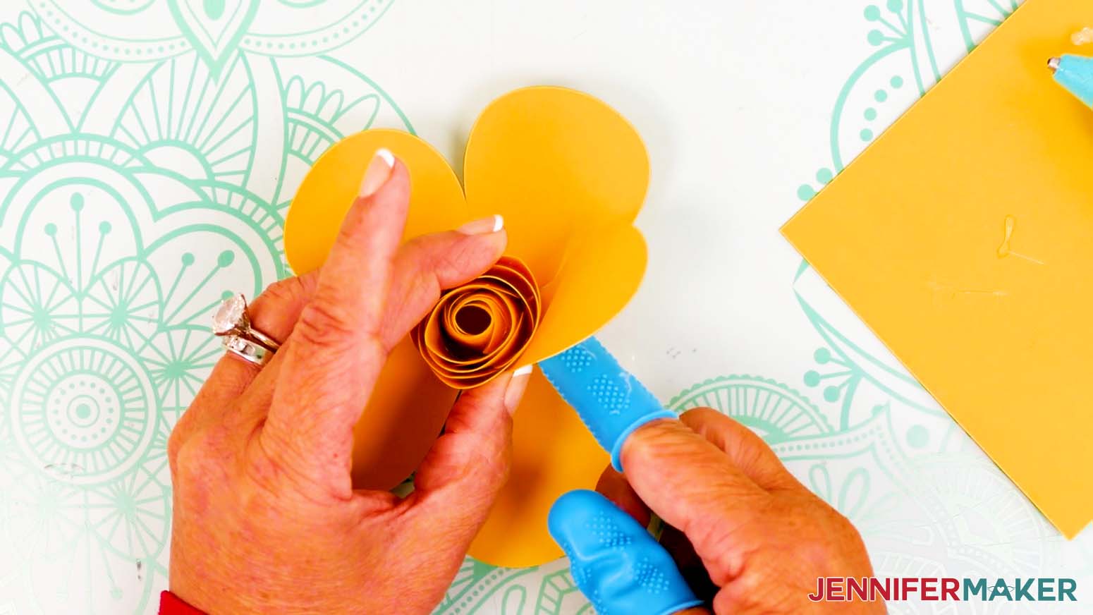 Press the first outer bud petal in place.