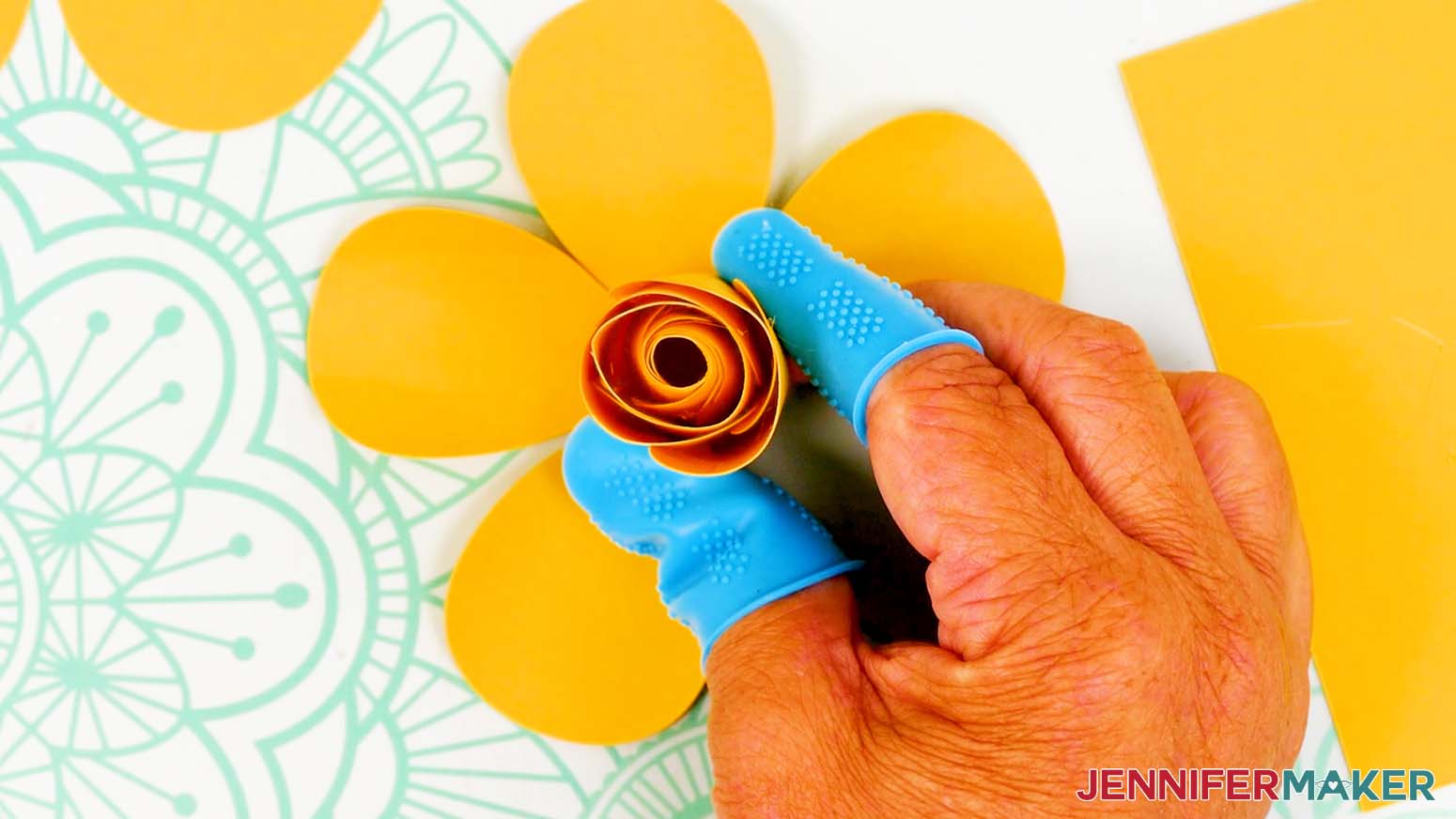 Alternate petals and glue them to the center of the bud.