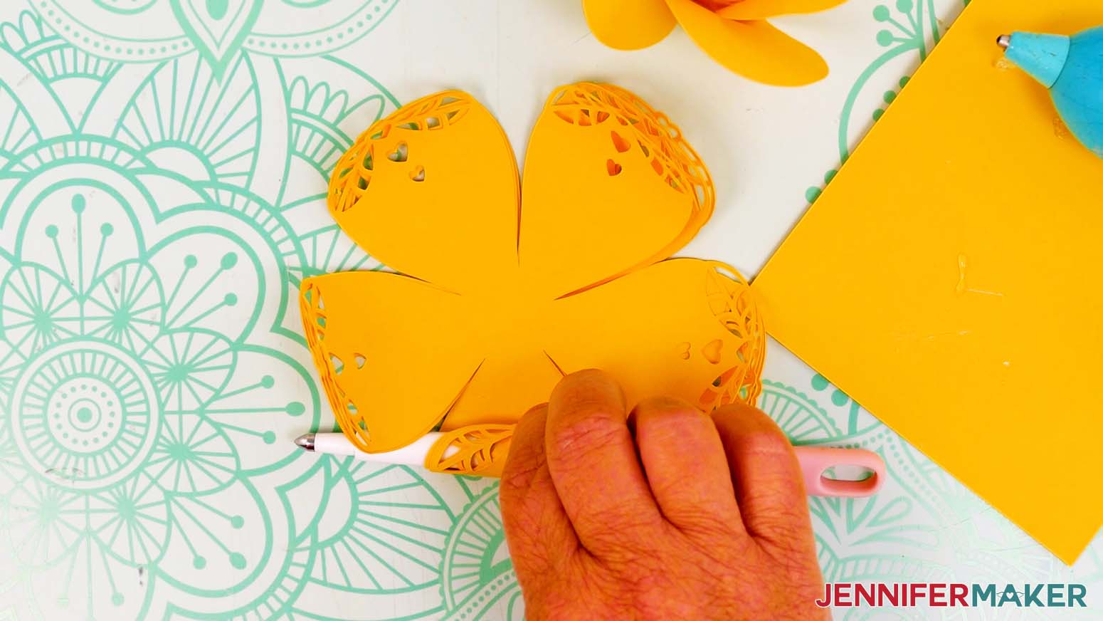 Use a scoring stylus to roll the edges of the lacy petals.