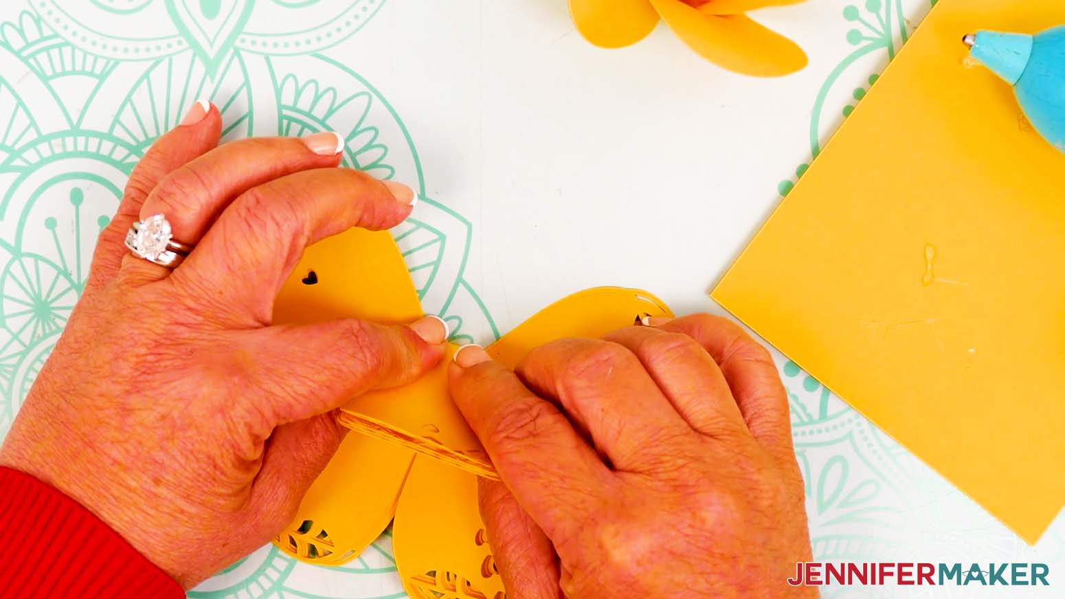 Fold the petal upward to create a crease around the center of the petal piece.