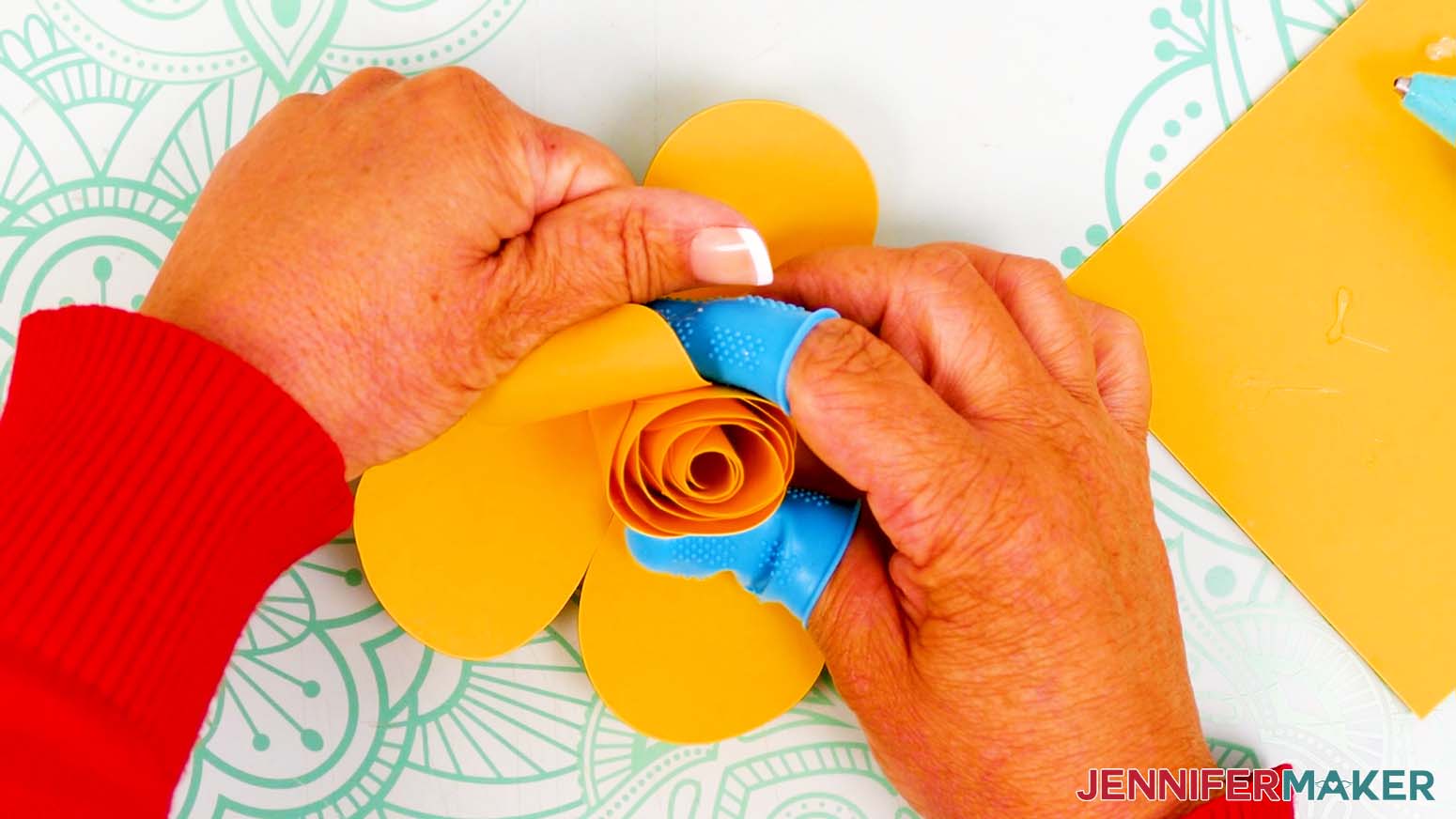 Gently shape the outer bud petals to curl them outward from the center.