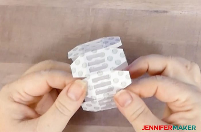 Folding and gluing the cap to make the paper gazebo luminary