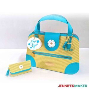 Flower Power and Daisy Duke wallet paper handbags in yellow and white cardstock with light blue accents.