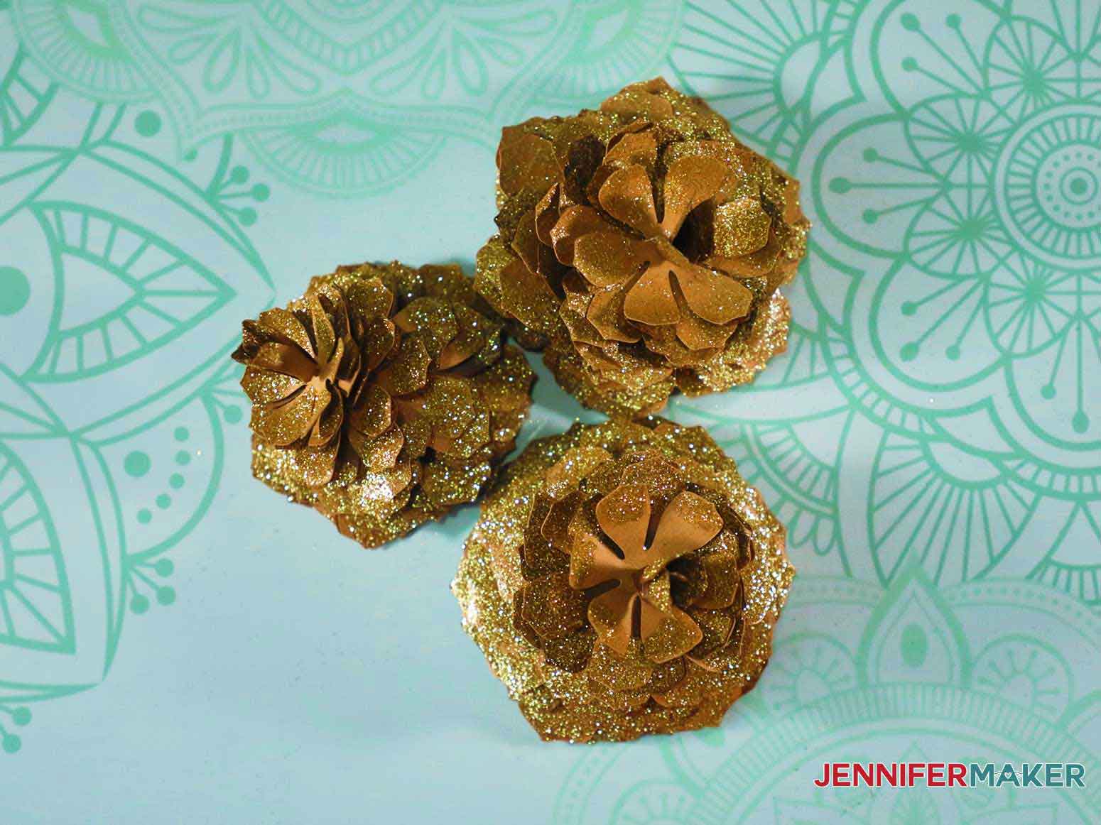 Glittery paper pinecones from above