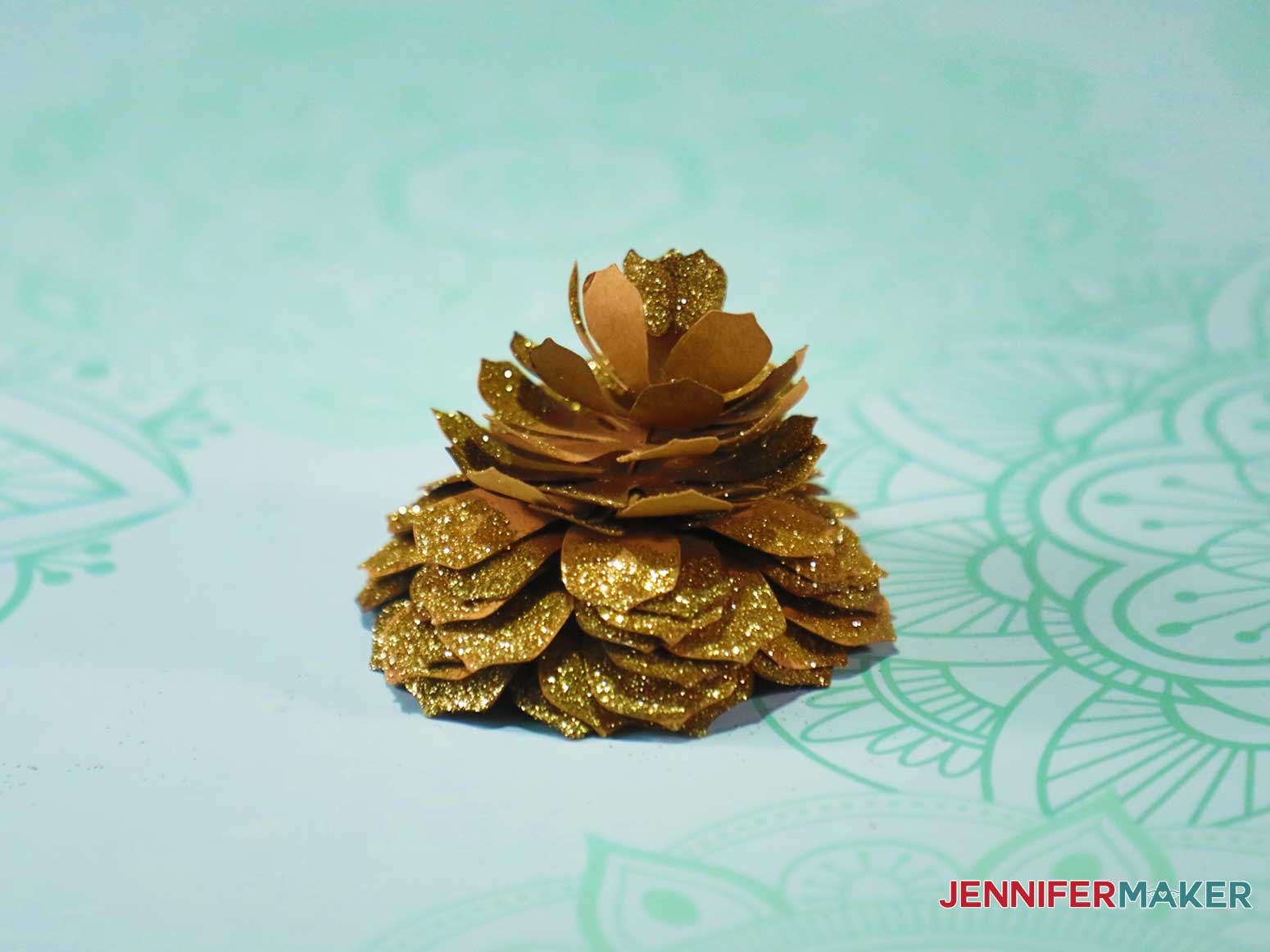 Single glittery paper pinecone