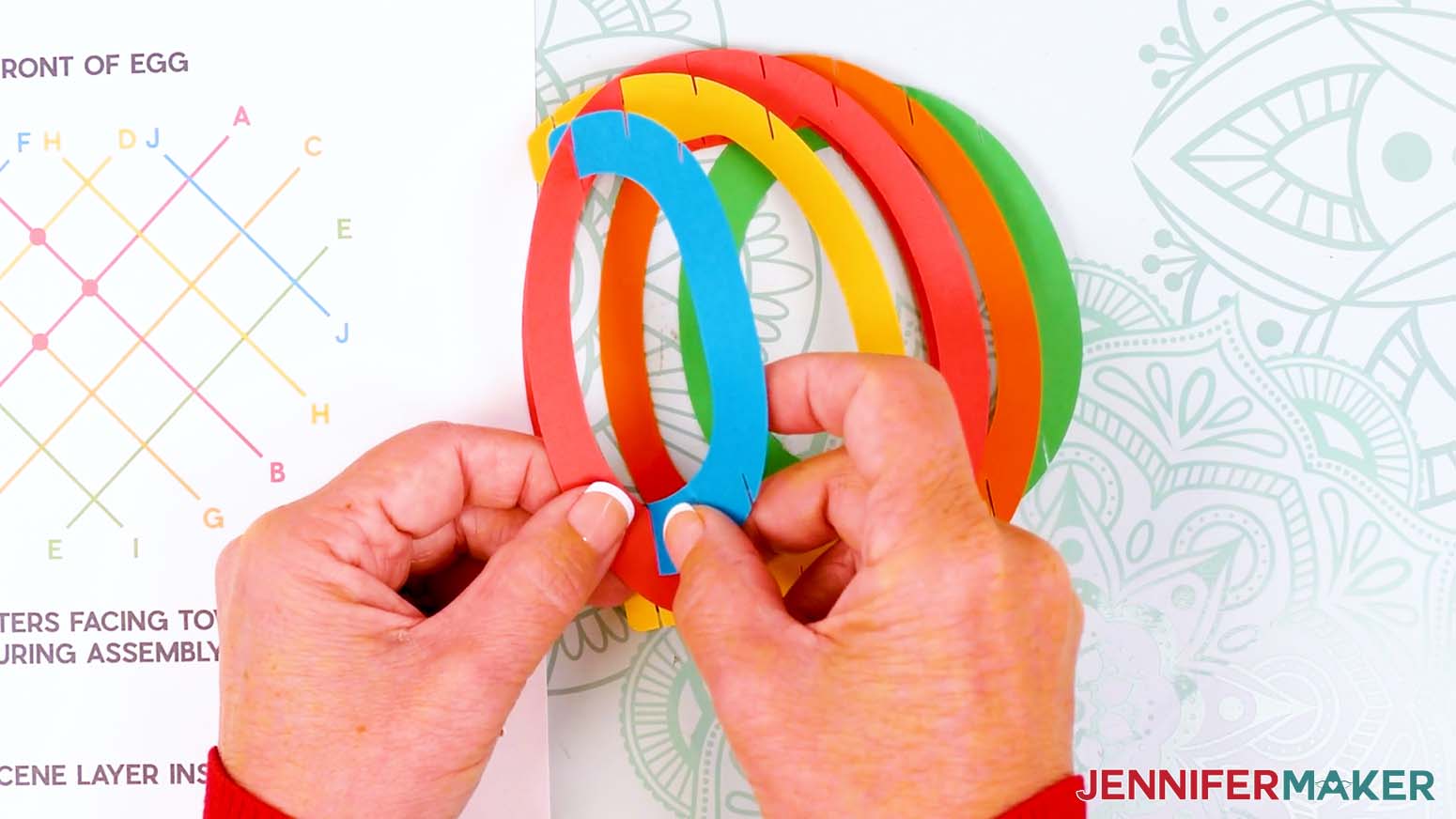Insert the frontmost slits on piece F into the outer slits on piece B.
