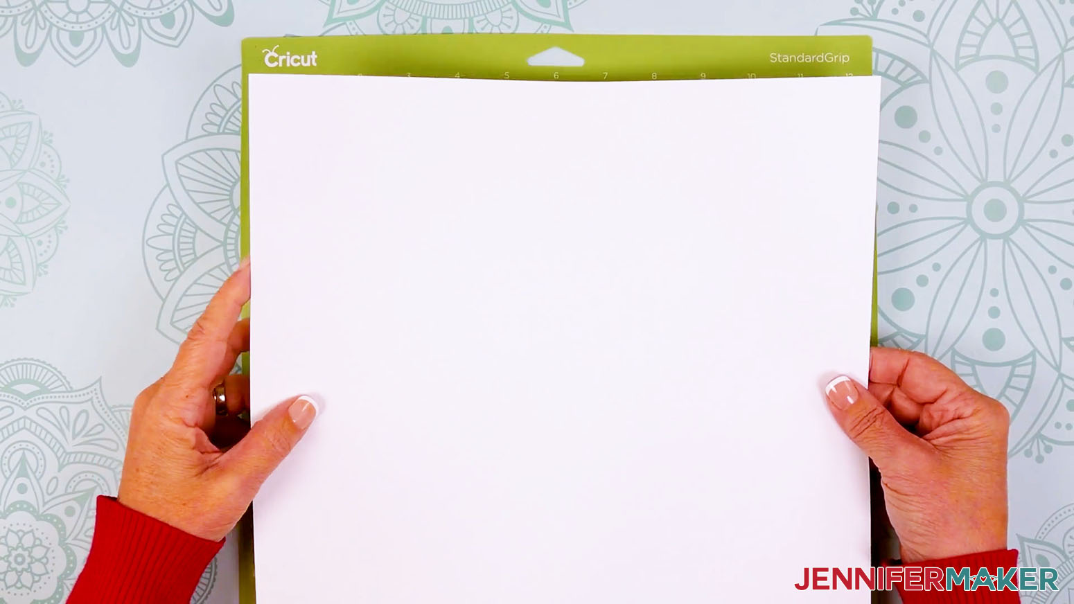 Place white cardstock onto a green machine mat.