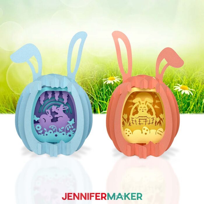 Two Paper Pop Up Easter Egg projects on display, each featuring pastel colors and intricate bunny scenes