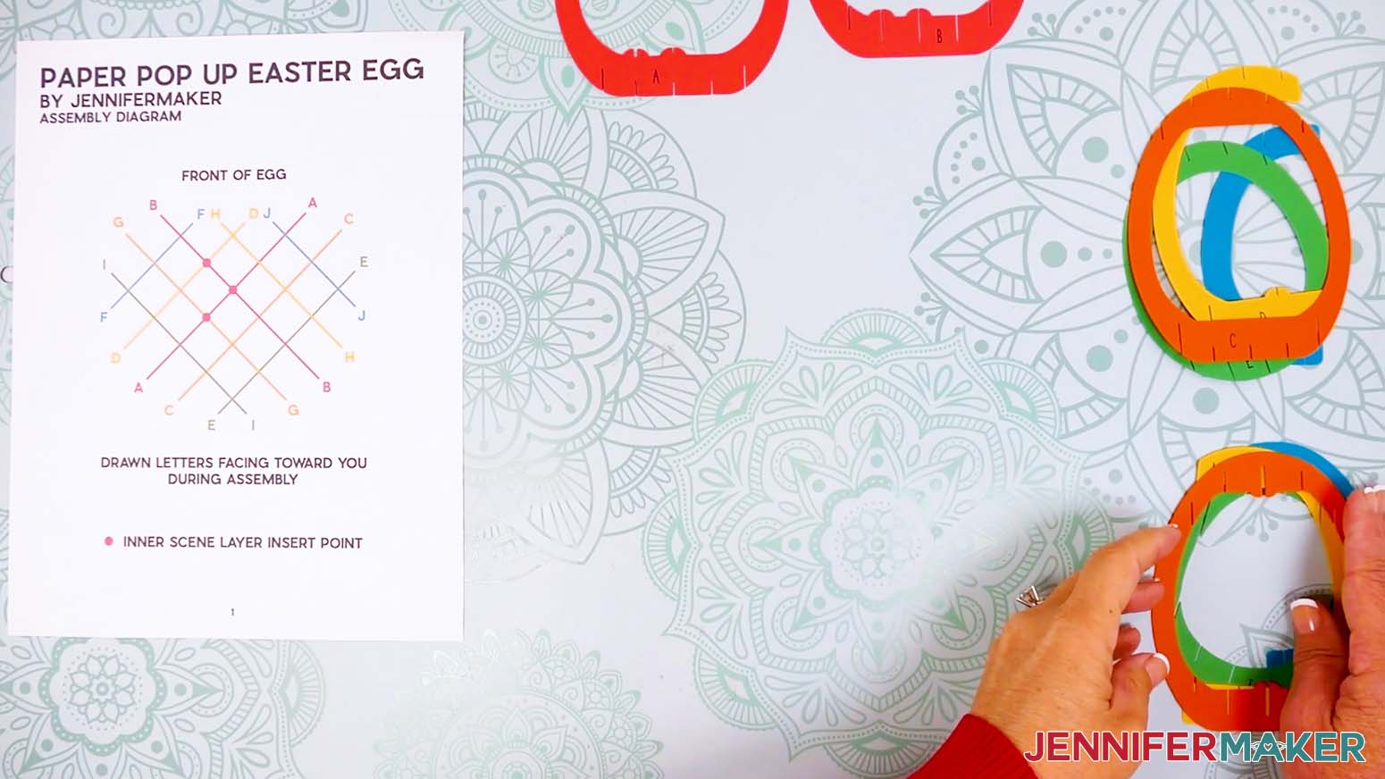 Place the pop up easter egg shell pieces into two stacks for the left and right half of the egg.