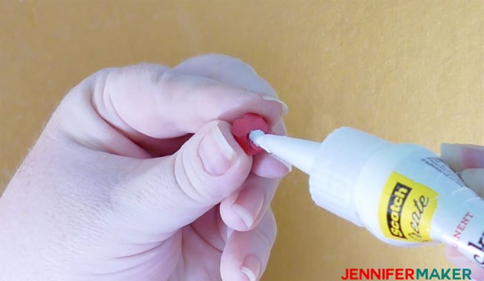 Glue the bottoms of miniature paper roses to make Paper Rose Arbor Luminary