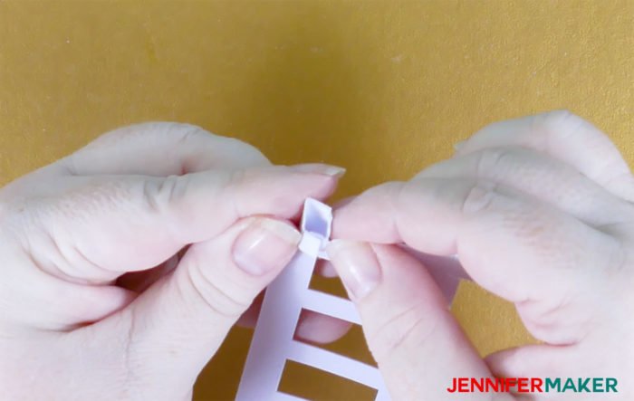 Folding the top to make Paper Rose Arbor Luminary