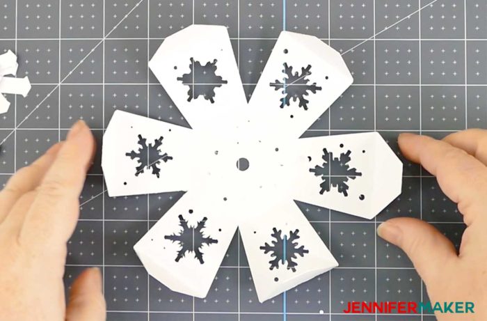 Fold the sides and flaps of the base top for the paper snowflake christmas tree luminary