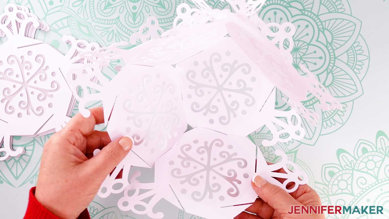 Five snowflake panels are interlocked.