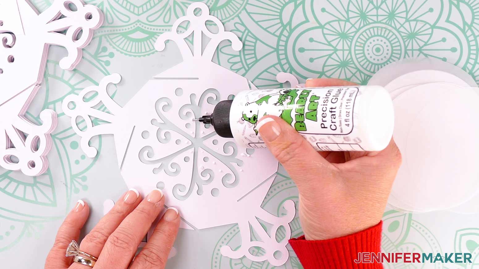 Put glue dots in the center of snowflake design.