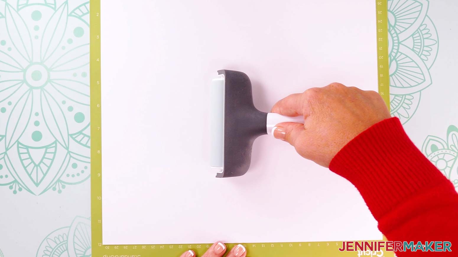 Use a brayer to adhere the kraft board to green standard grip mat.