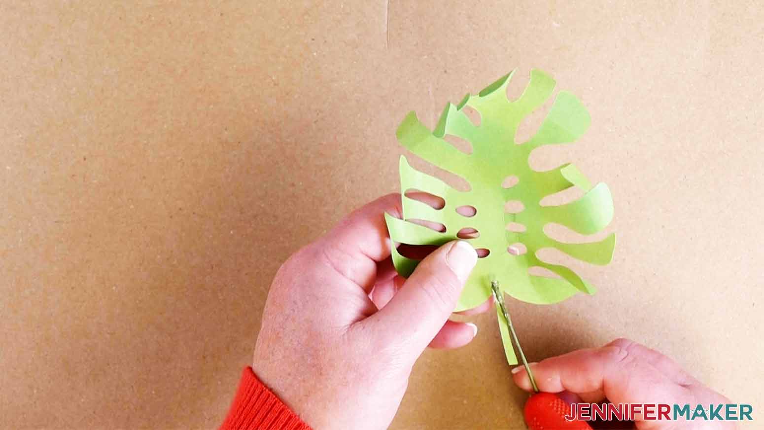 Glue the floral wire to the monstera leaf when making my paper succulents project