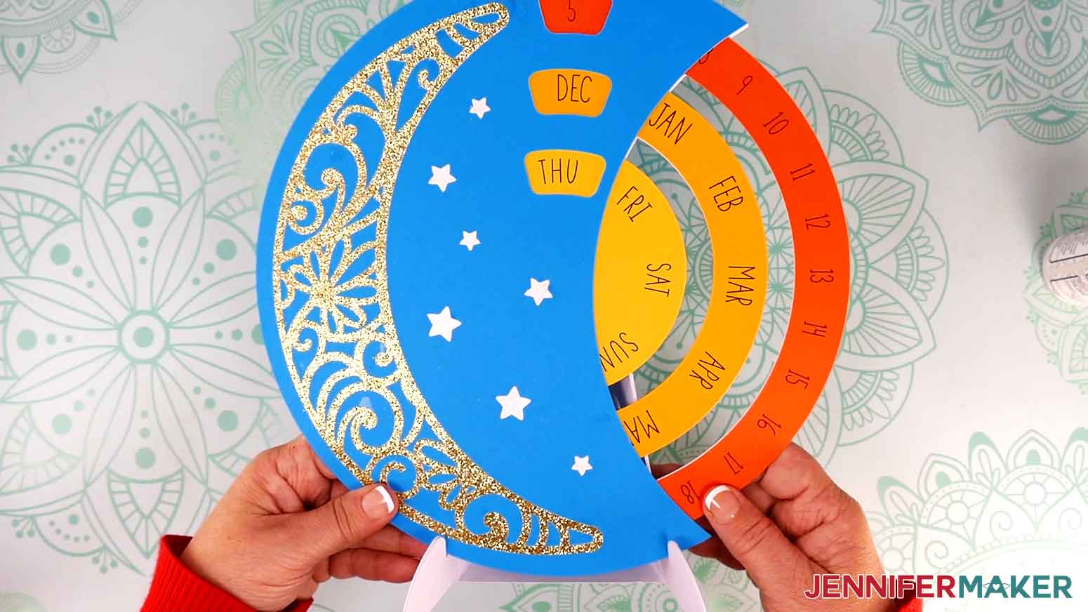 The complete perpetual calendar on its assembled stand with glitter moon and star pieces on the front