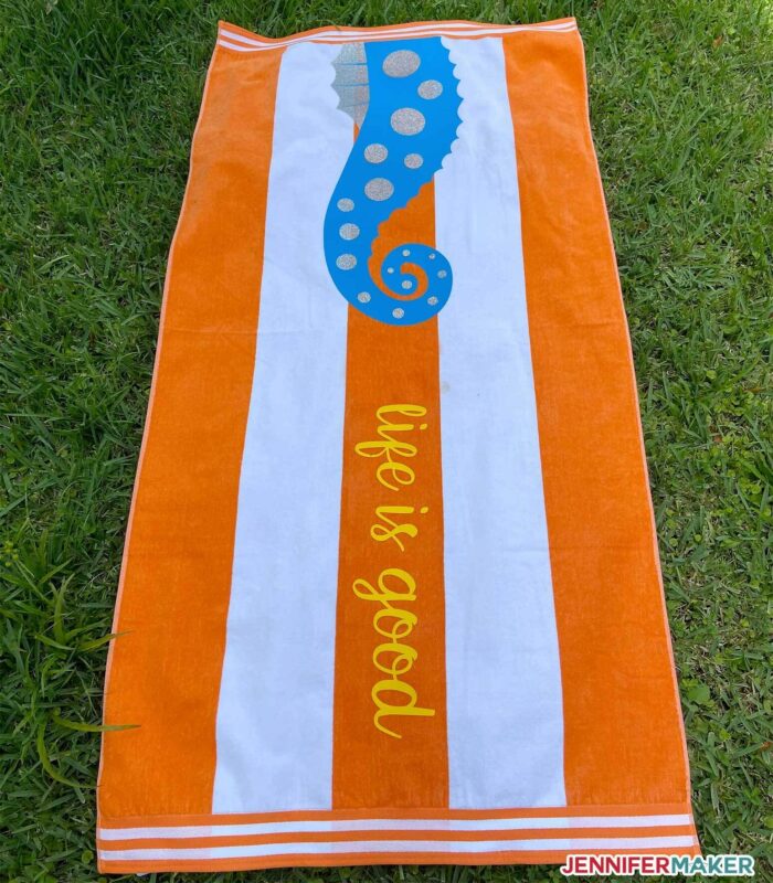 Orange towel with Smart Iron On Vinyl in yellow, blue, and silver with a seahorse!