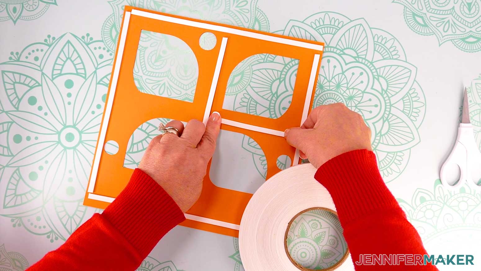 On the back of the next stacked layer, cut and add strips of foam tape around the border, down the center, and in any other open areas.