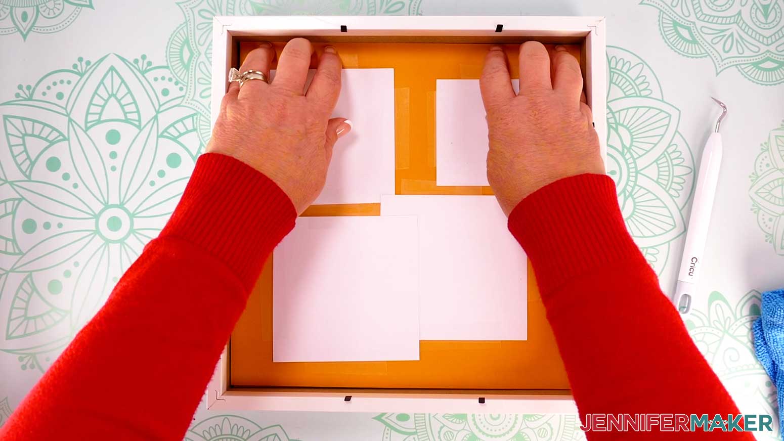 Place your cardstock layers face down inside the shadow box on top of the glass, pressing the layers forward until the top layer touches the glass.