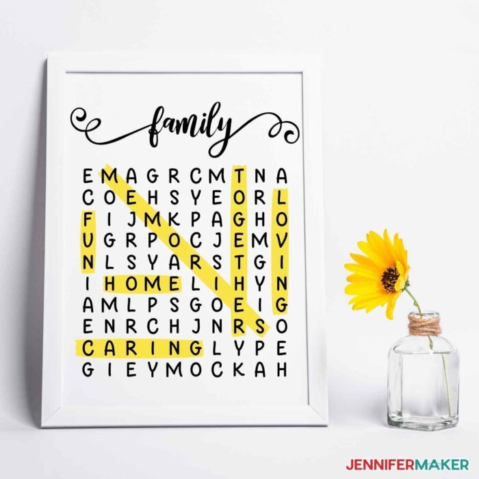 Framed picture frame word search with small clear vase beside