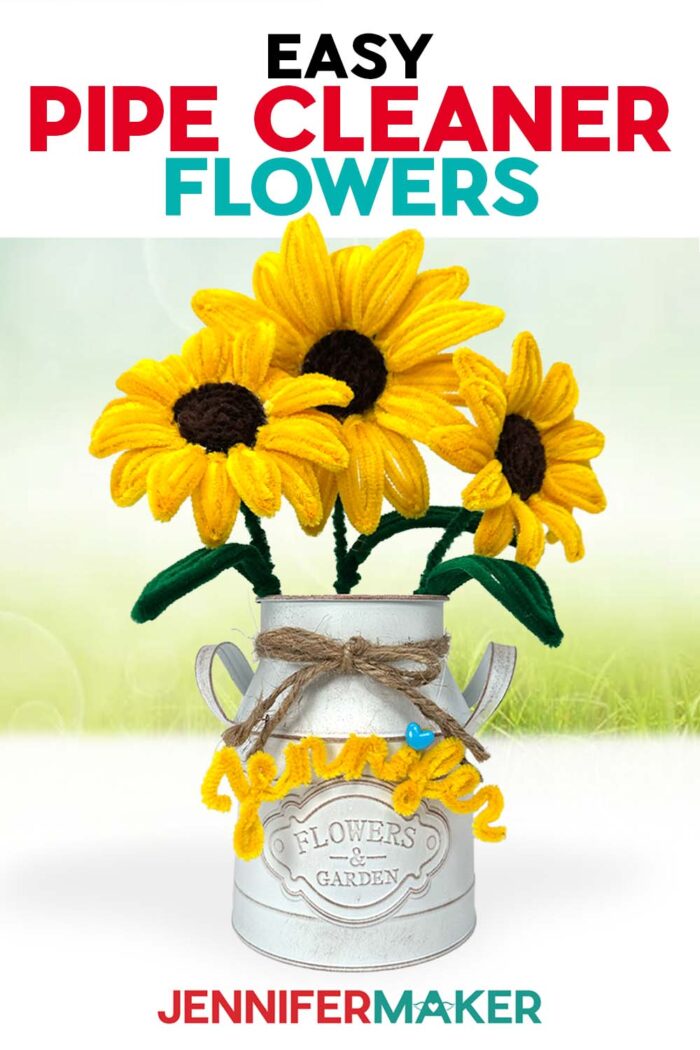Easy Pipe Cleaner Flowers in a white vase, tied with twine, crafted with yellow pipe cleaners to look like realistic sunflowers. A yellow pipe cleaner name "Jennifer" decorates the vase. Learn how to make the flowers with Jennifer Maker, using her free files and tutorial!